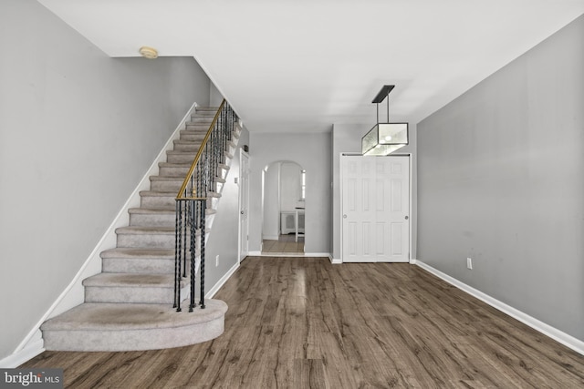 foyer entrance with hardwood / wood-style floors