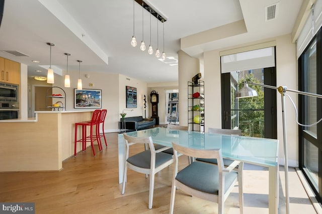 dining room featuring light hardwood / wood-style flooring