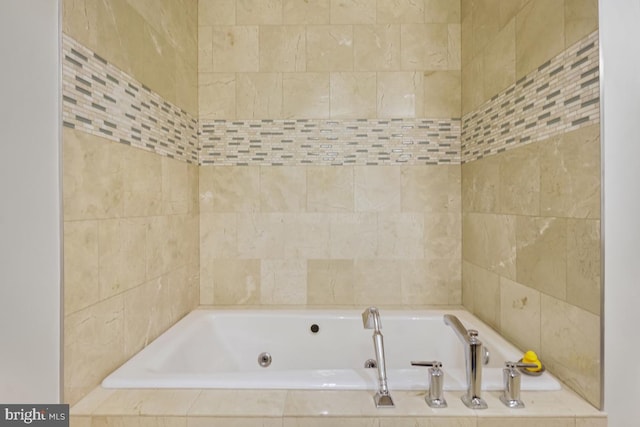 bathroom featuring tiled bath