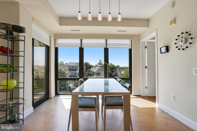 dining space featuring light wood-type flooring