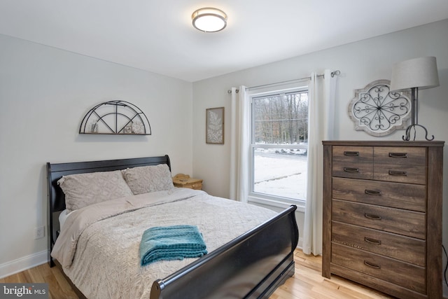 bedroom with light wood-type flooring