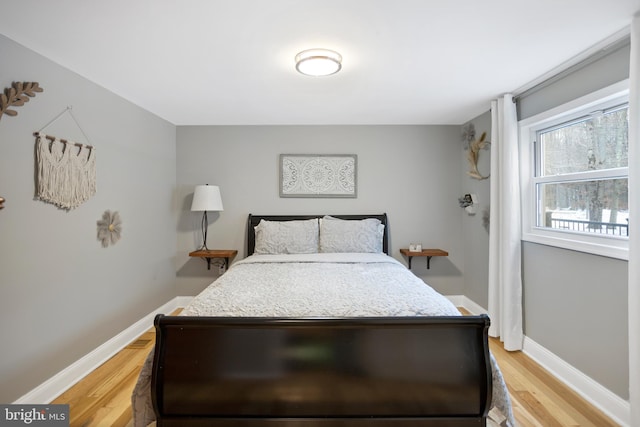 bedroom with light hardwood / wood-style floors