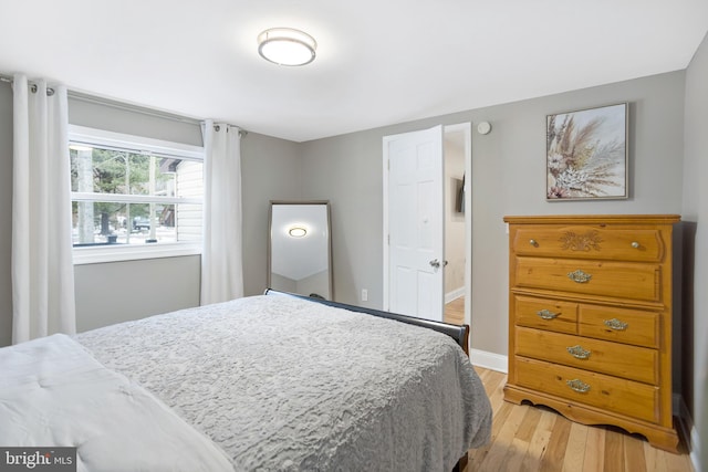 bedroom with light wood-type flooring