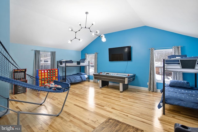 recreation room featuring wood-type flooring and a healthy amount of sunlight