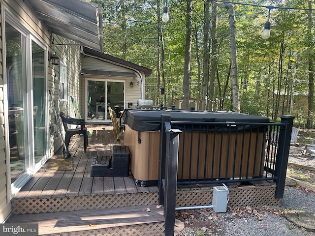 deck with a hot tub