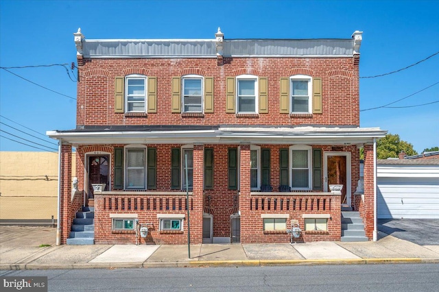 townhome / multi-family property featuring a porch