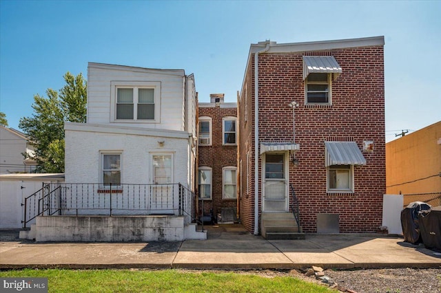 view of front of property featuring brick siding