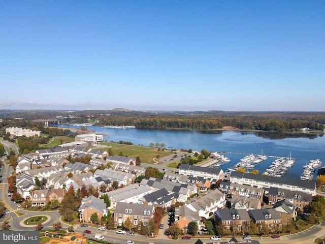 birds eye view of property with a residential view and a water view