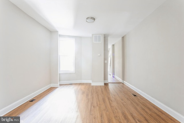 spare room featuring light wood-type flooring