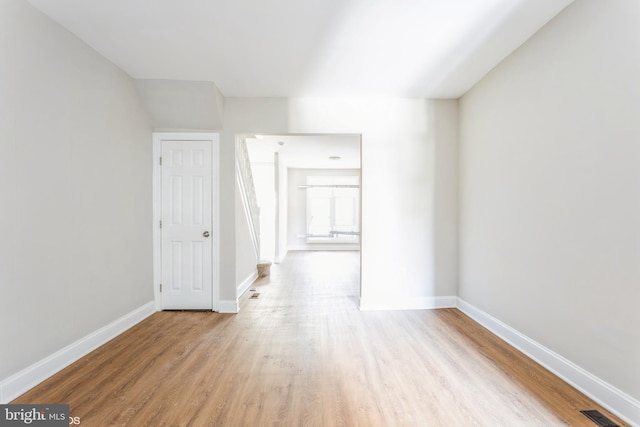 spare room featuring light wood-type flooring