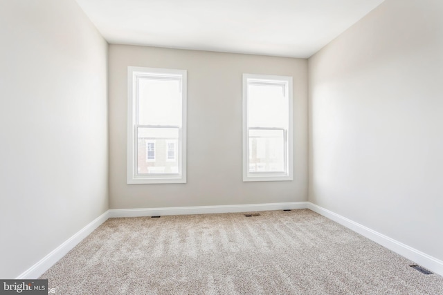 spare room with light carpet