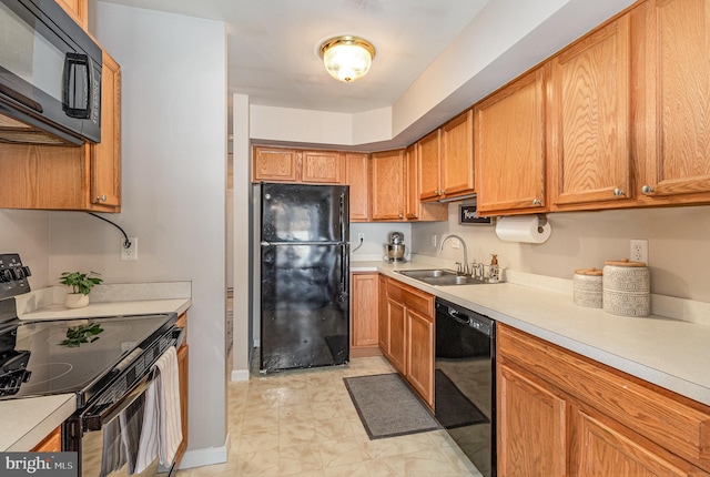 kitchen with sink and black appliances