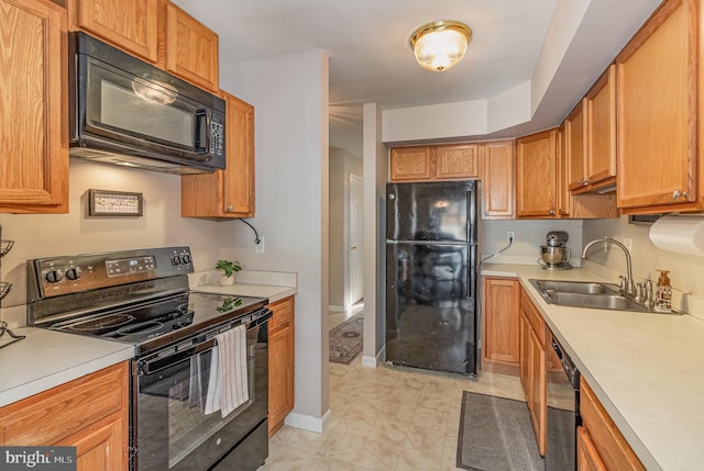 kitchen featuring sink and black appliances