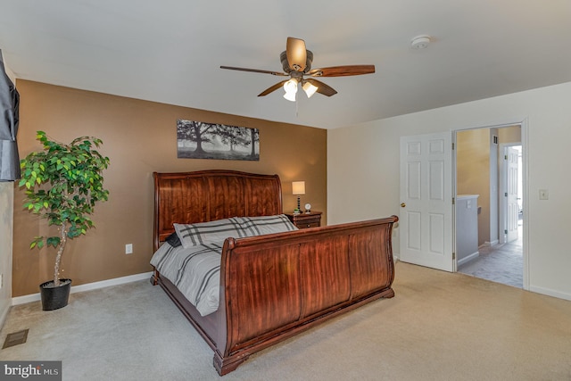 bedroom featuring light colored carpet and ceiling fan