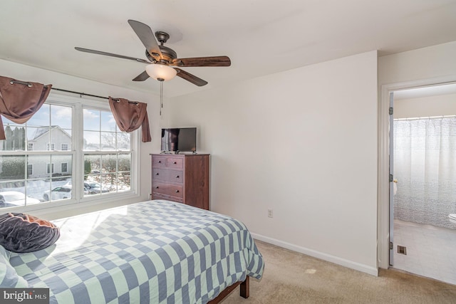 bedroom featuring light colored carpet and ceiling fan