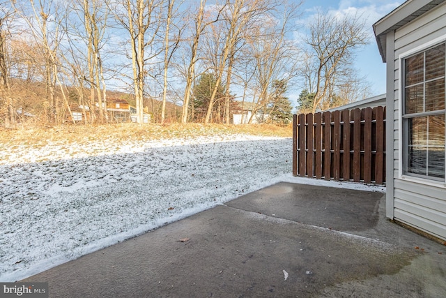 view of yard layered in snow