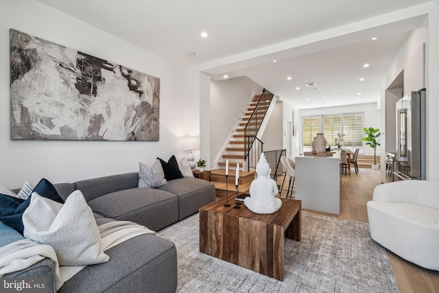 living room with light hardwood / wood-style floors