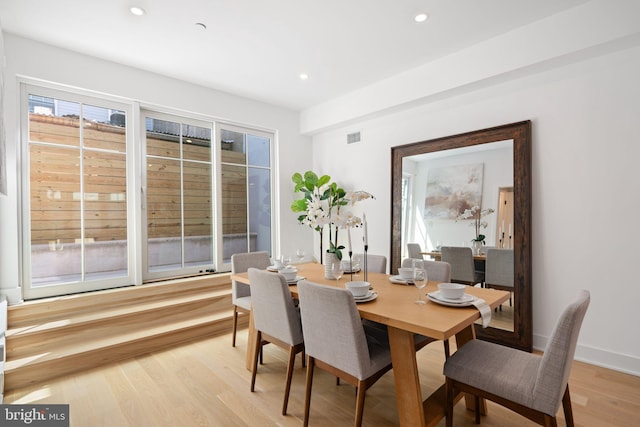 dining area with light hardwood / wood-style flooring