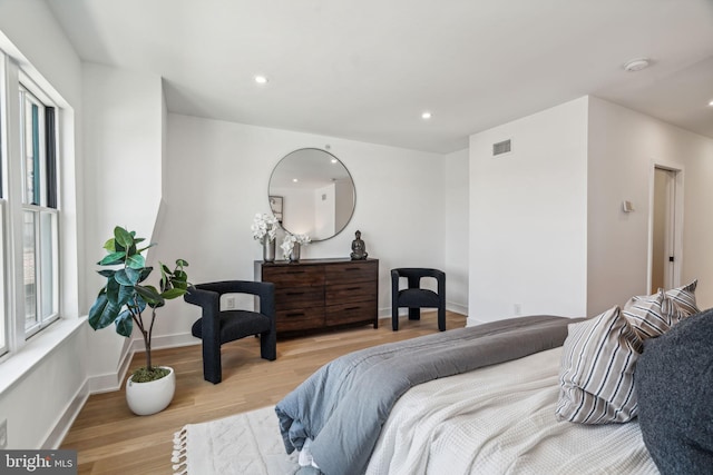 bedroom with light hardwood / wood-style flooring