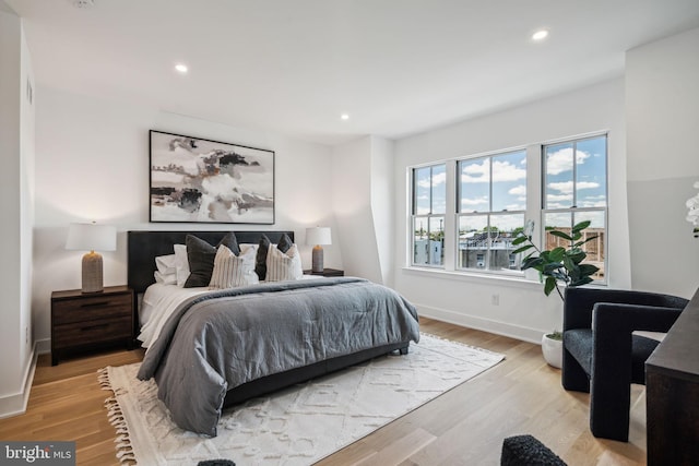 bedroom with light wood-type flooring