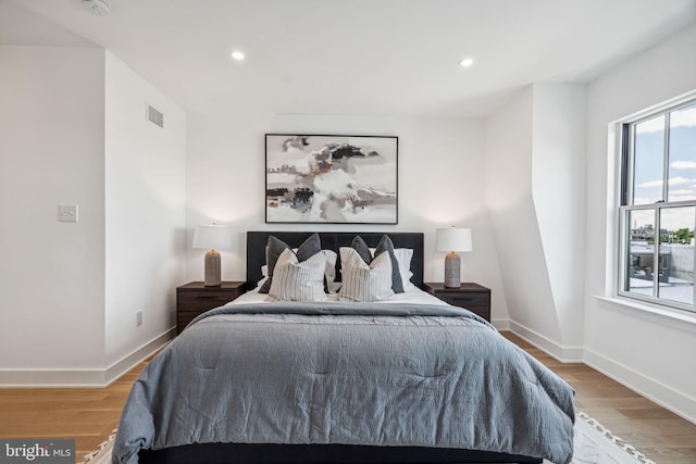 bedroom with light hardwood / wood-style flooring