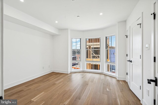 unfurnished bedroom with light hardwood / wood-style floors