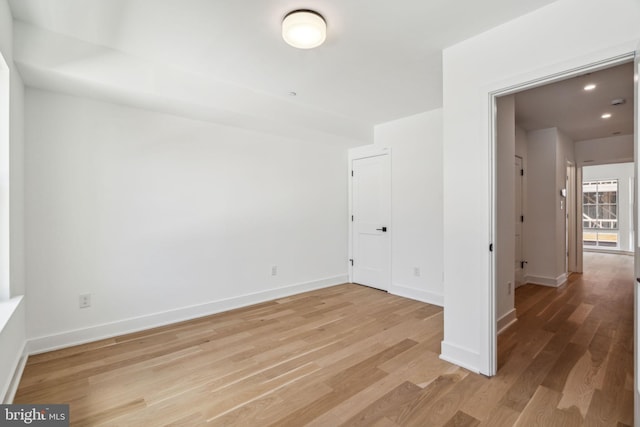 unfurnished room featuring light hardwood / wood-style flooring