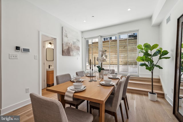 dining space featuring light hardwood / wood-style floors