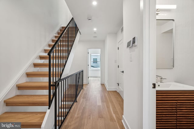 interior space with sink and hardwood / wood-style floors