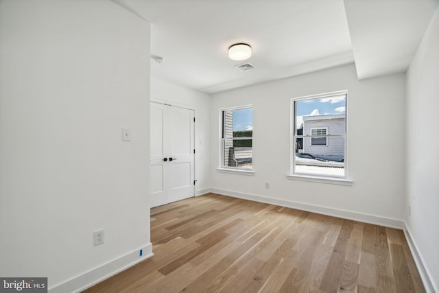 spare room featuring light hardwood / wood-style flooring