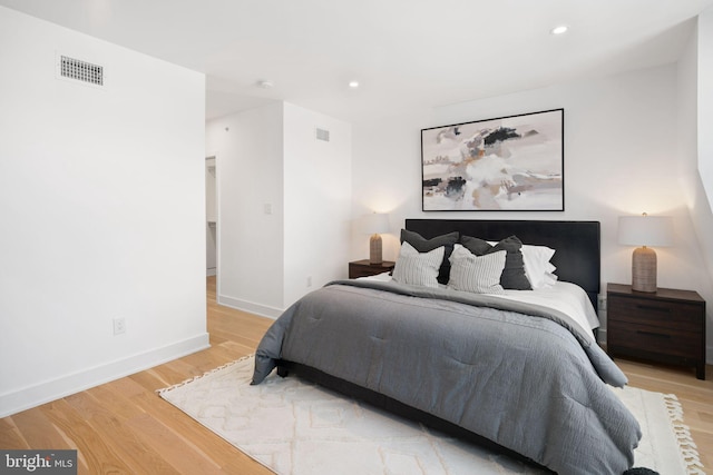 bedroom with light hardwood / wood-style floors