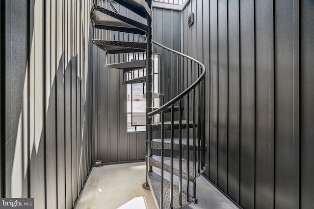 stairs with concrete floors