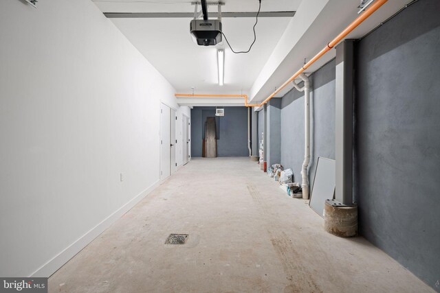 hall with concrete flooring