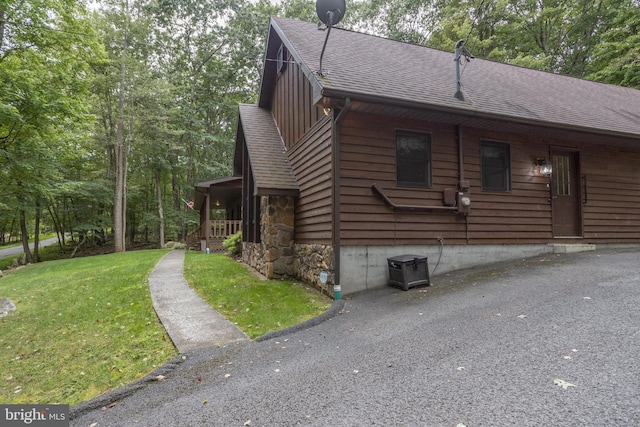 view of home's exterior with a yard