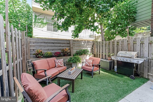 view of patio / terrace with area for grilling and an outdoor hangout area