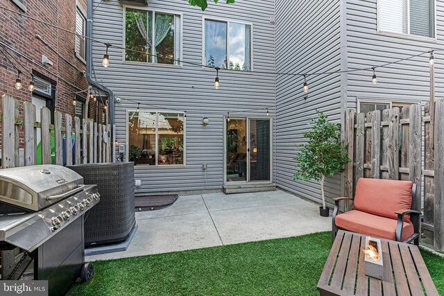 view of patio featuring a grill