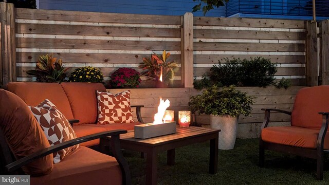 view of patio / terrace with a fire pit