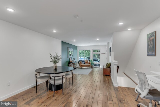 dining area with light hardwood / wood-style floors