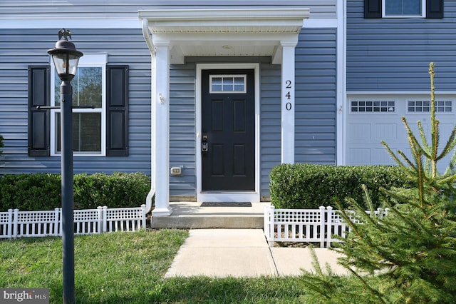 entrance to property featuring a garage