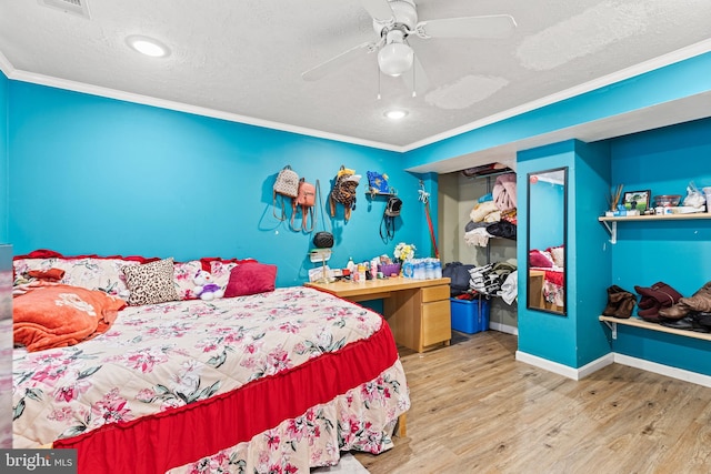 5120 Crittenden St, Hyattsville, MD 20781 - bedroom with wood finished floors, crown molding, a textured ceiling, baseboards, and ceiling fan