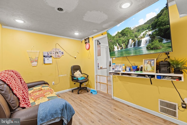 5120 Crittenden St, Hyattsville, MD 20781 - living area featuring baseboards, wood finished floors, a textured ceiling, recessed lighting, and ornamental molding