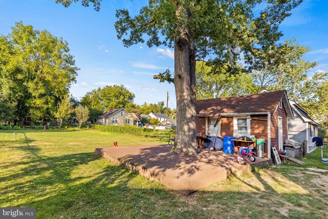 5120 Crittenden St, Hyattsville, MD 20781 - view of green lawn featuring a patio