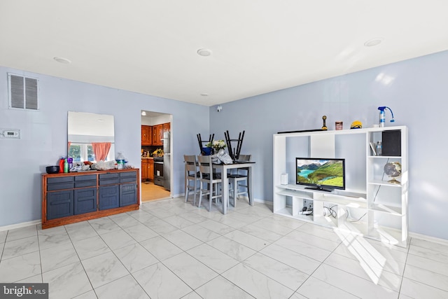 5120 Crittenden St, Hyattsville, MD 20781 - living room featuring light marble finish flooring and baseboards