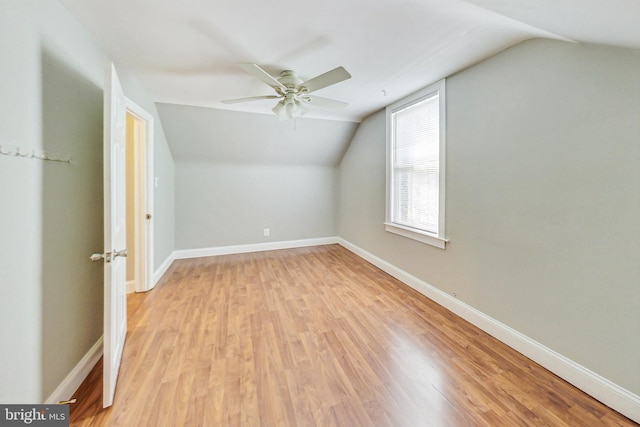 additional living space featuring lofted ceiling, ceiling fan, and light hardwood / wood-style floors