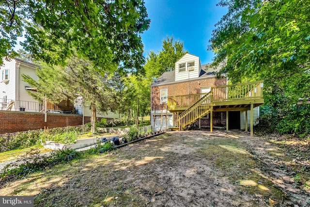 back of property featuring a deck