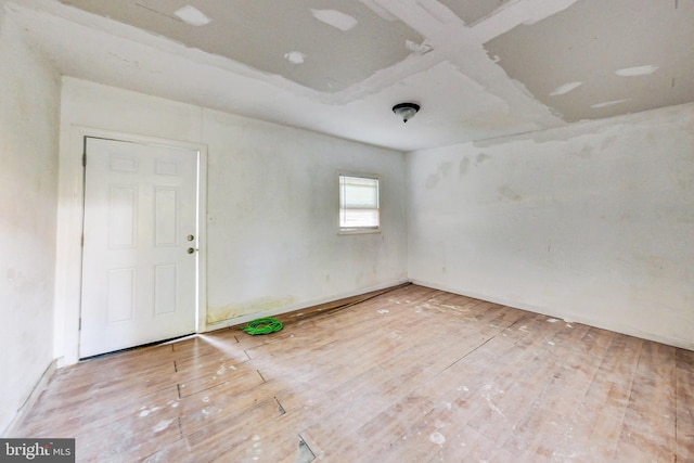 unfurnished room featuring hardwood / wood-style floors