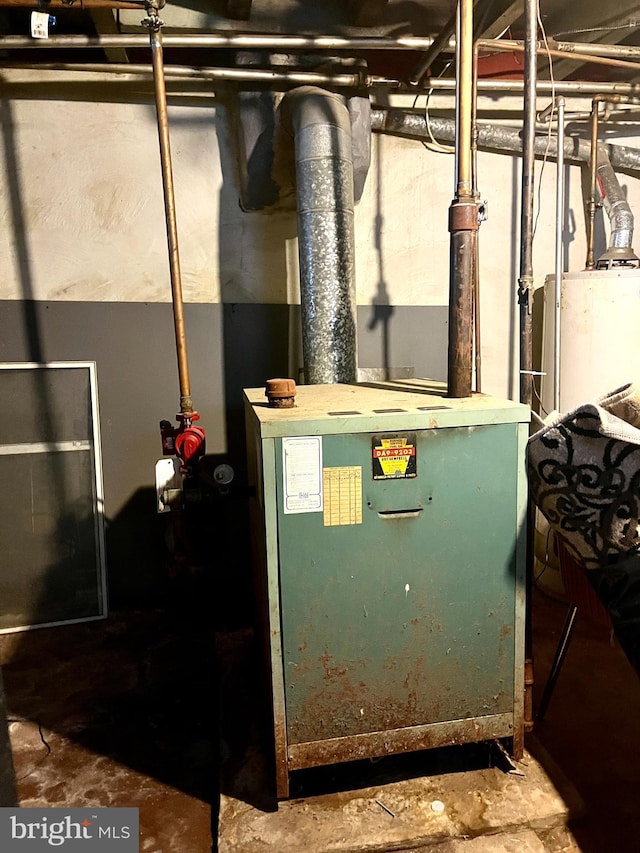 utility room with water heater