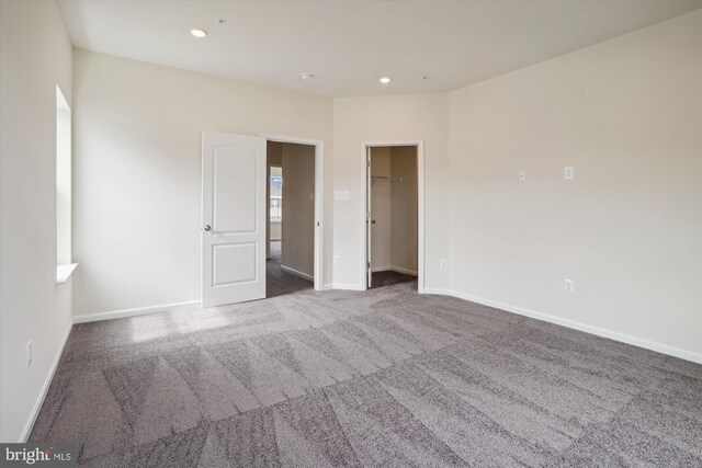 carpeted dining room with a chandelier