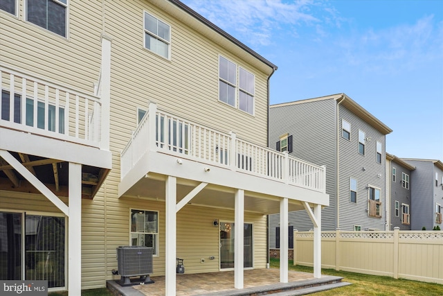 back of property featuring central AC and a patio area