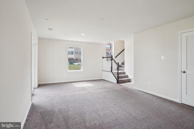 spare room featuring carpet floors